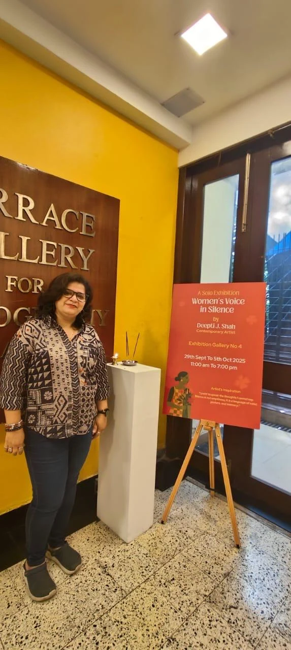 Deepti J. Shah beside the Women’s Voice in Silence exhibition sign at Jehangir Art Gallery